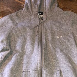 A grey Nike zip up hoodie